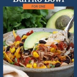 chicken burrito bowl next to fresh cilantro and sliced avocados.