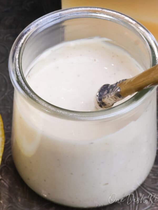 a small jar of homemade caesar salad dressing.