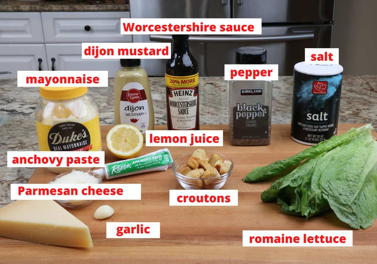 caesar salad ingredients on a kitchen counter.