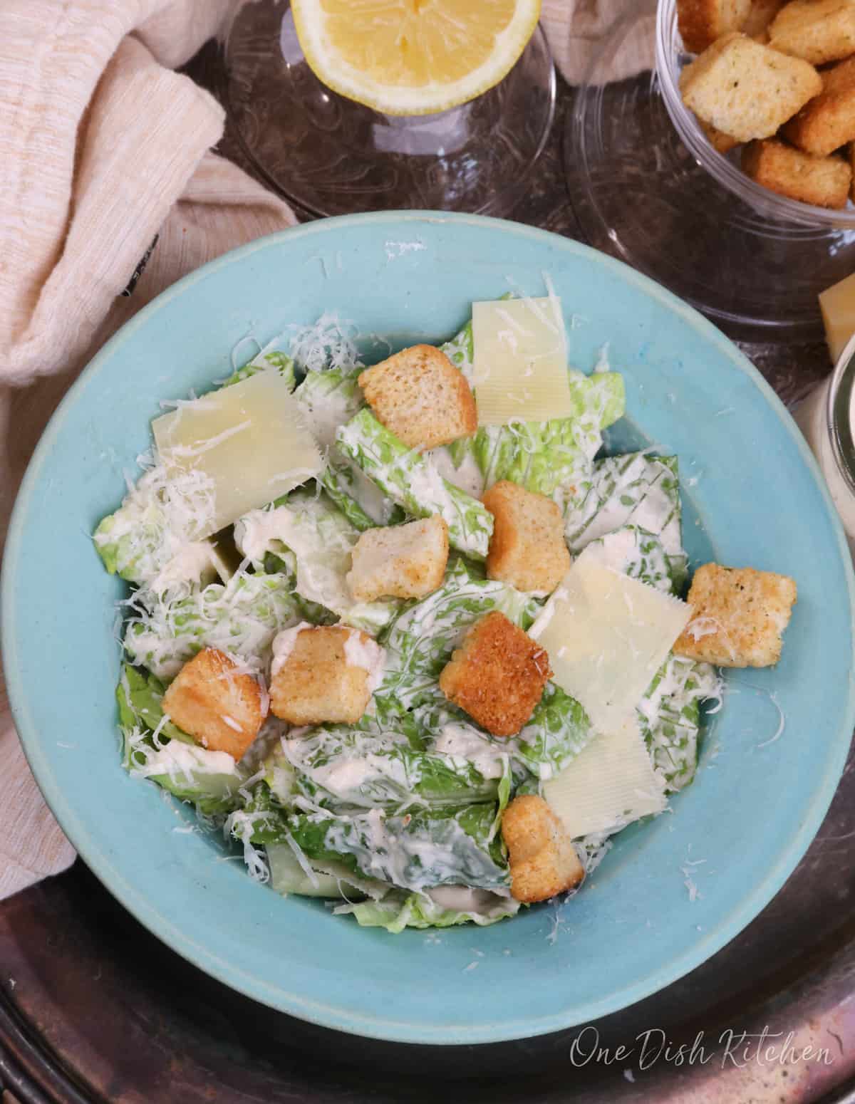Caesar Salad in a blue bowl.