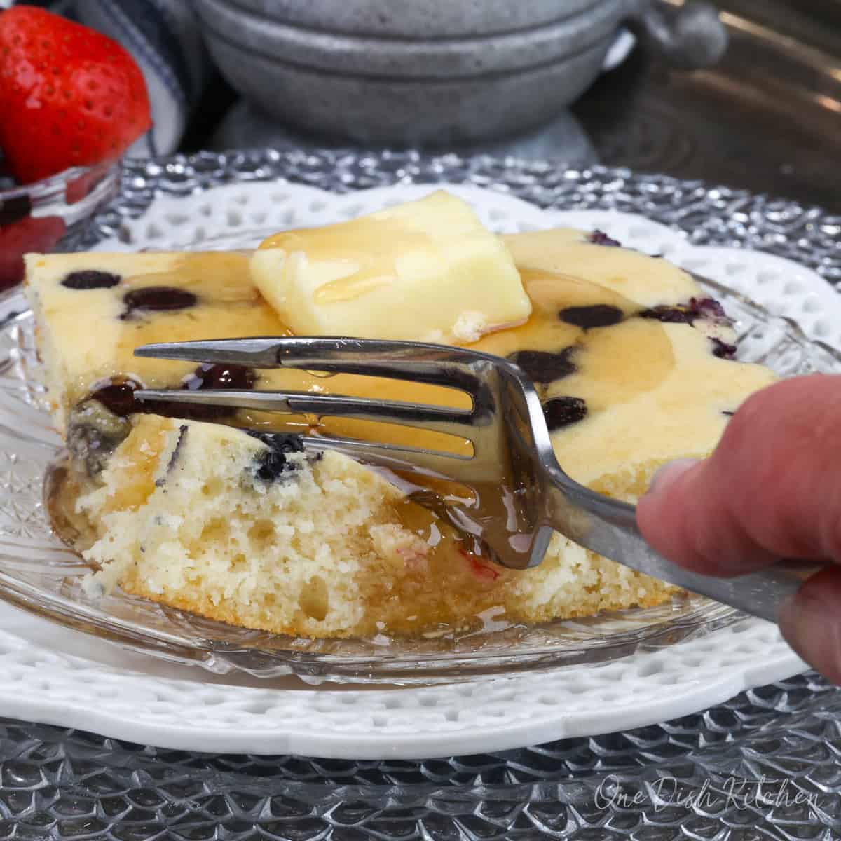 a square pancake on a plate with syrup.
