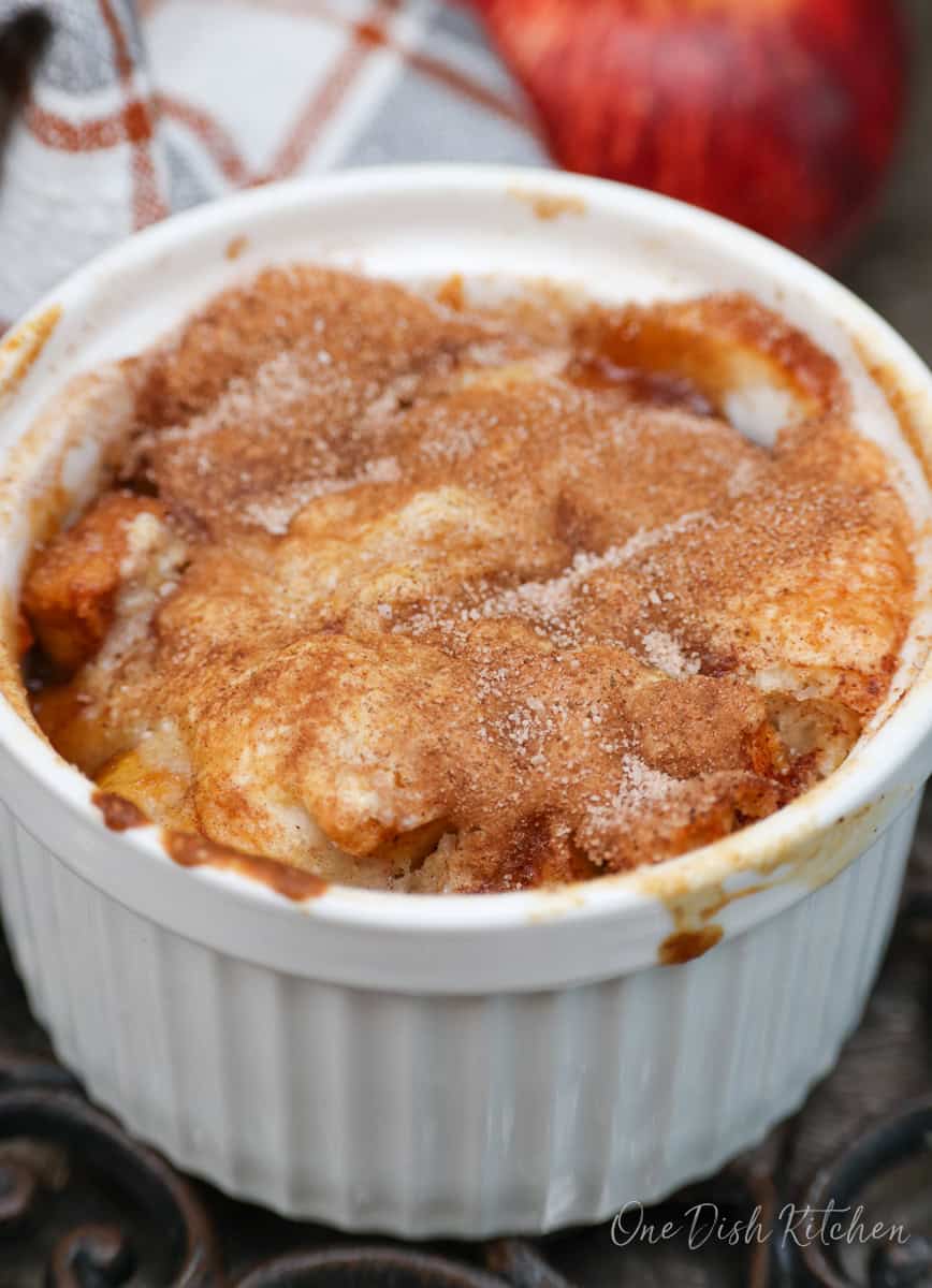 an individual apple cobbler on a cooling rack.
