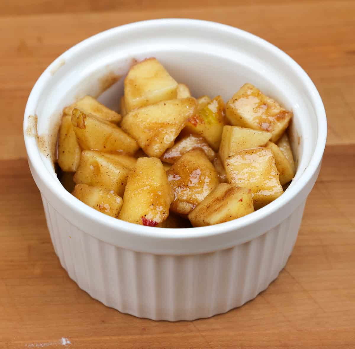 unbaked apple cobbler without the topping on a kitchen counter.
