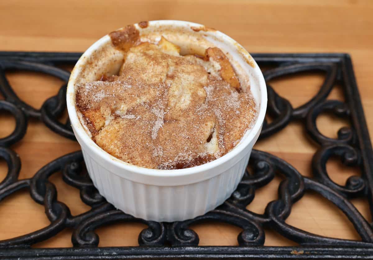 an individual apple cobbler on a cooling rack.