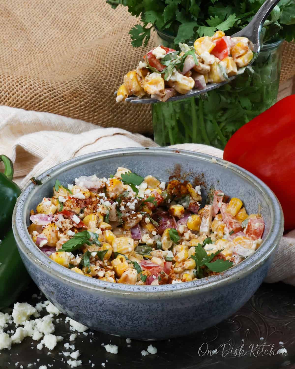 a partially eaten bowl of Mexican Street Corn Salad.