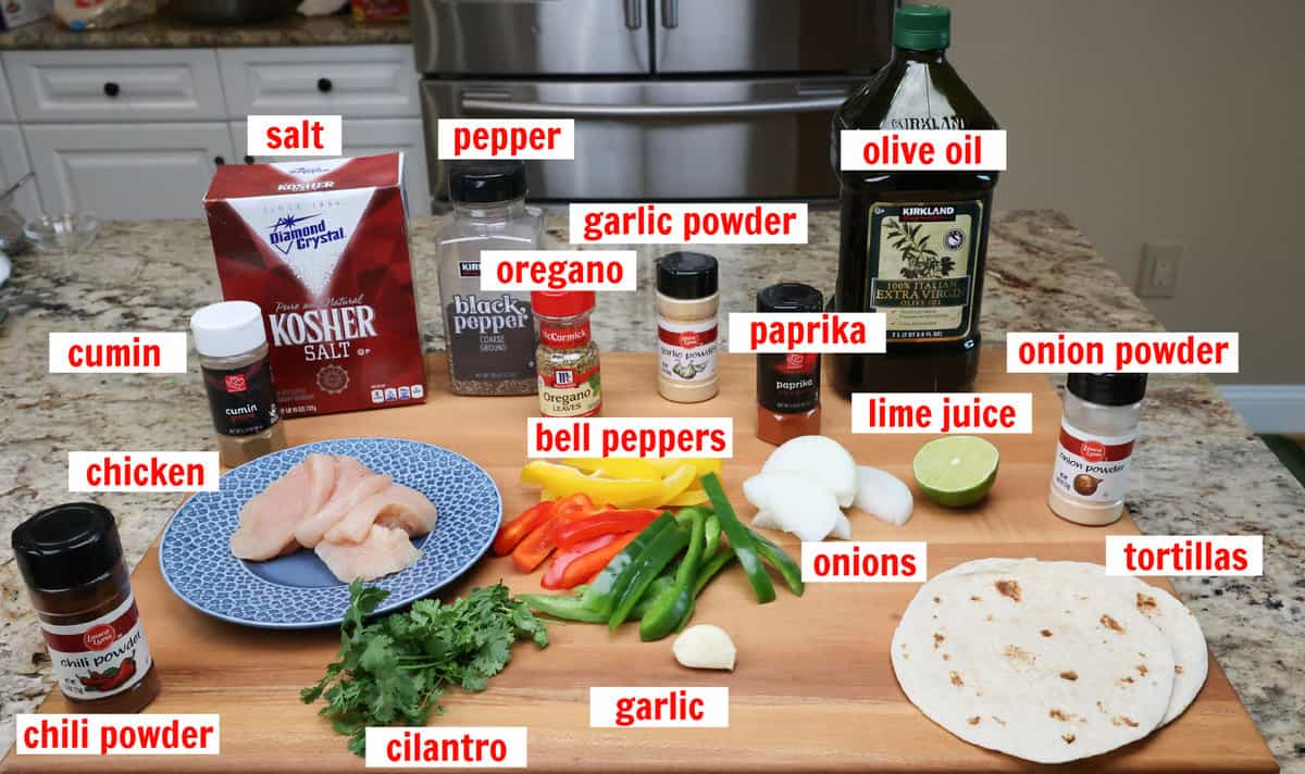 sheet pan chicken fajitas ingredients on a kitchen counter.