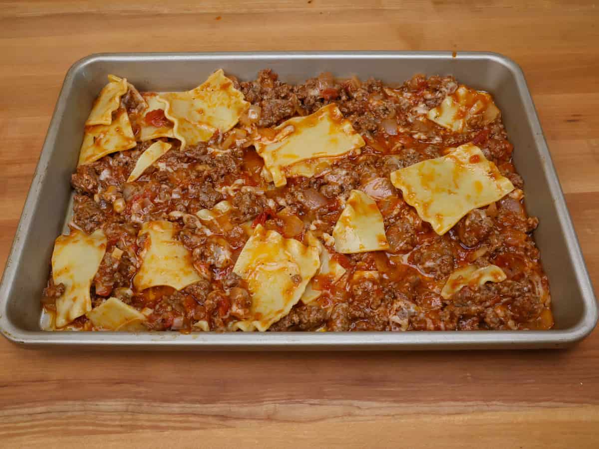 unbaked sheet pan lasagna on a sheet pan.