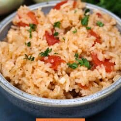 a blue bowl filled with spanish rice.