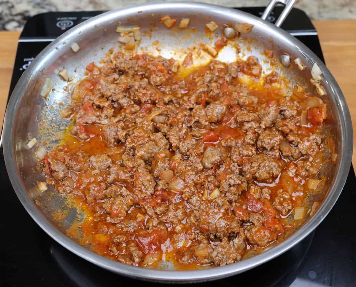 meat sauce simmering in a skillet.