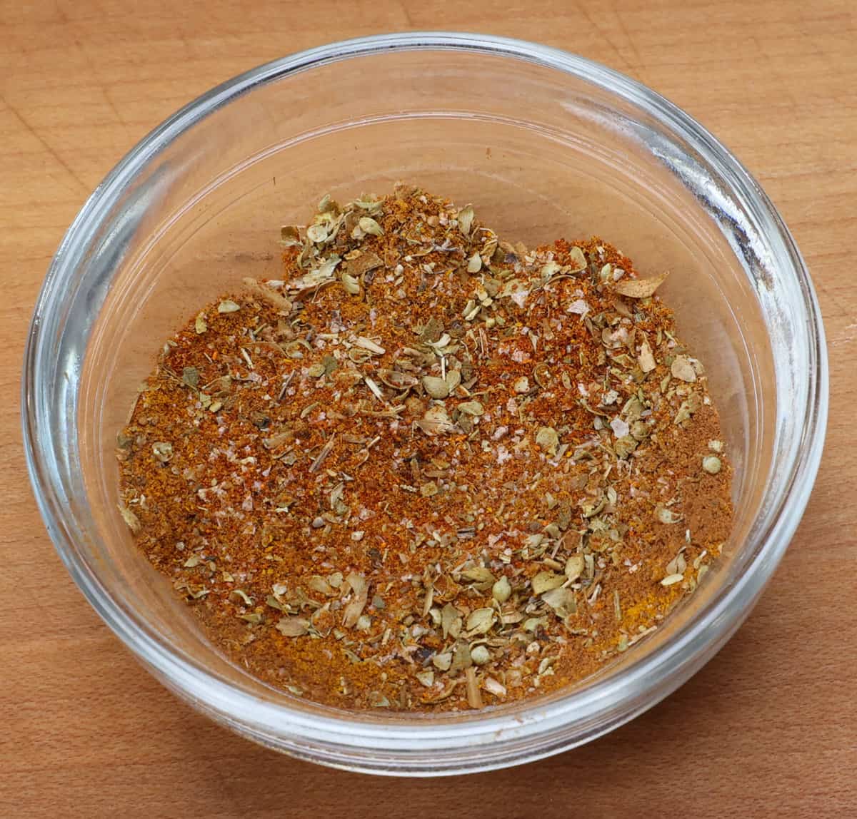 ropa vieja spice mix in a small bowl on a kitchen counter.