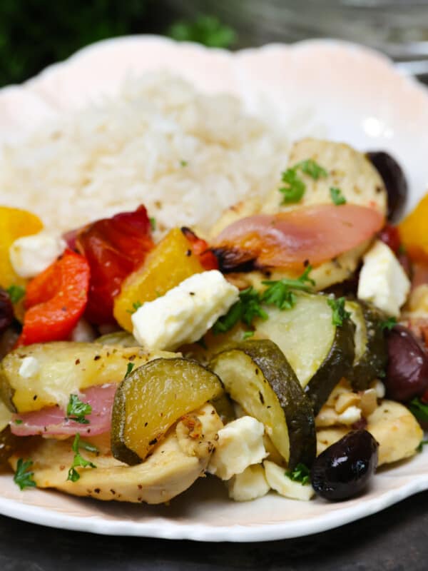greek chicken on a plate with rice