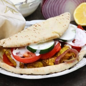 homemade chicken shawarma on pita with tzatziki sauce.