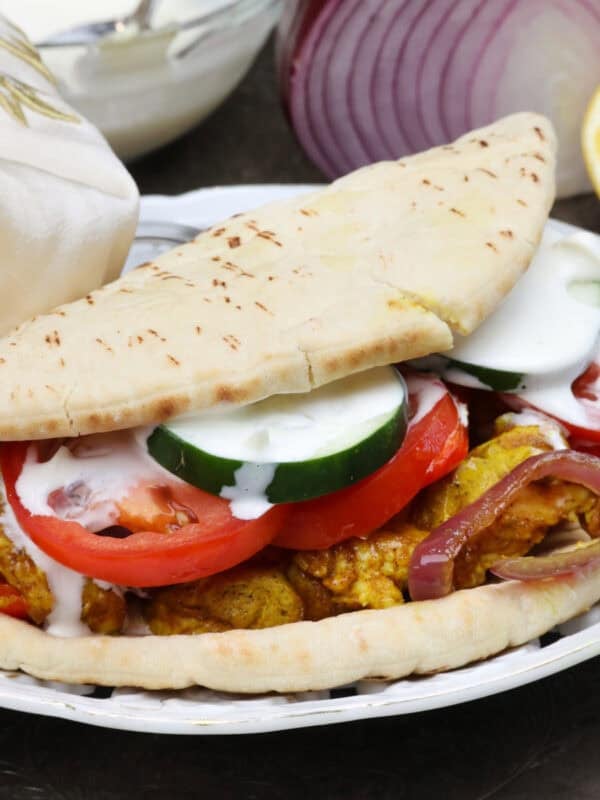 homemade chicken shawarma on pita with tzatziki sauce.