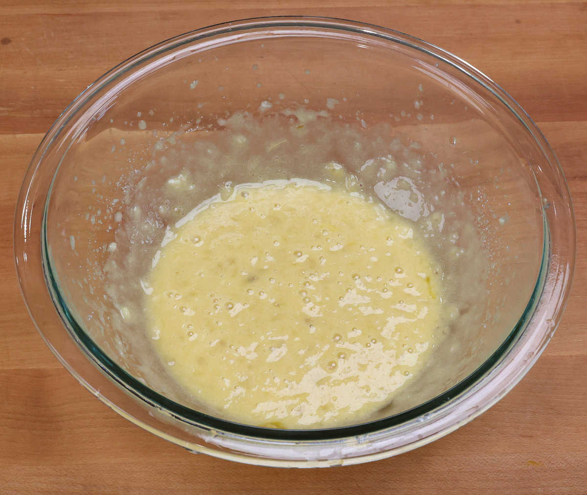 egg yolk and the other wet ingredients in banana bread in a mixing bowl.