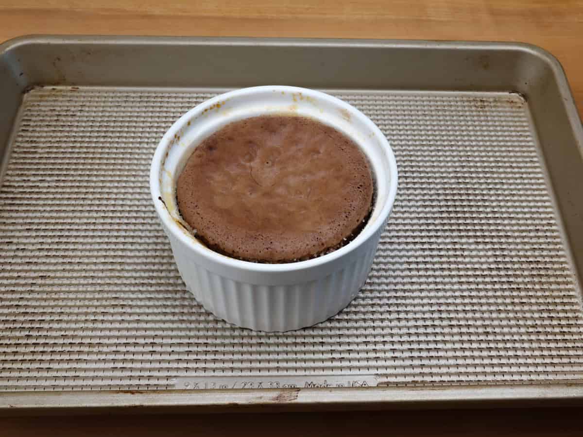 a small baked molten lava cake in a ramekin.