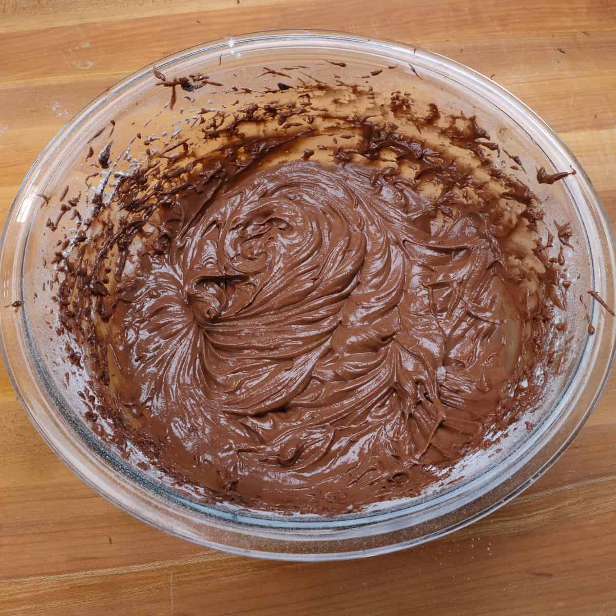 incorporating flour and sour cream into the german chocolate cake batter.