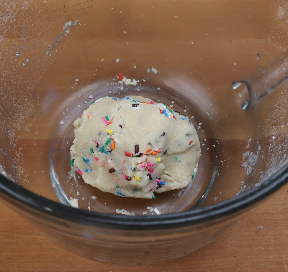 shortbread dough kneaded into a ball in a mixing bowl.