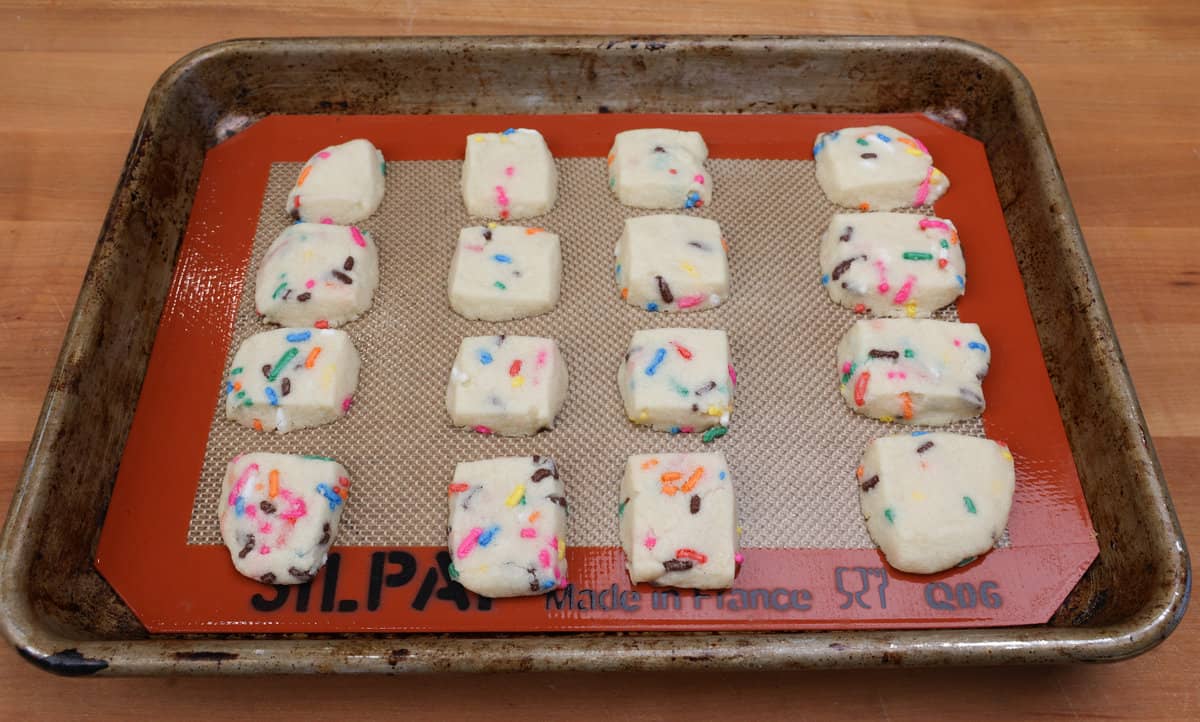 baked funfetti cookie bites on a small baking sheet.