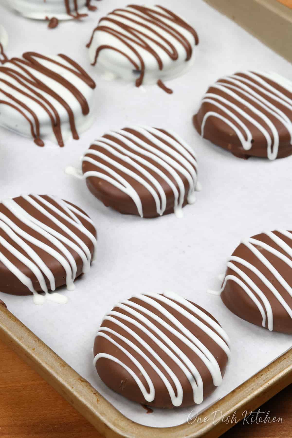 a tray of chocolate covered oreos.