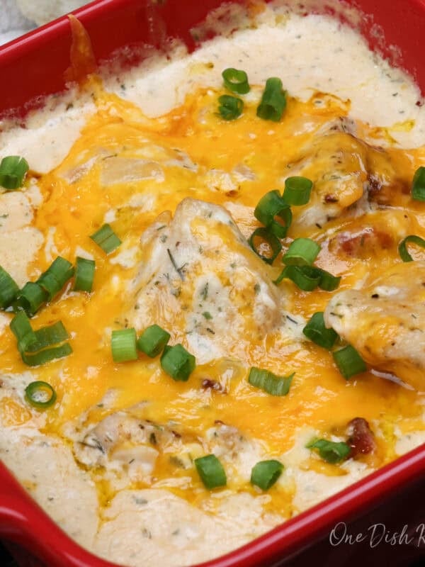 a small serving of crack chicken in a red baking dish.