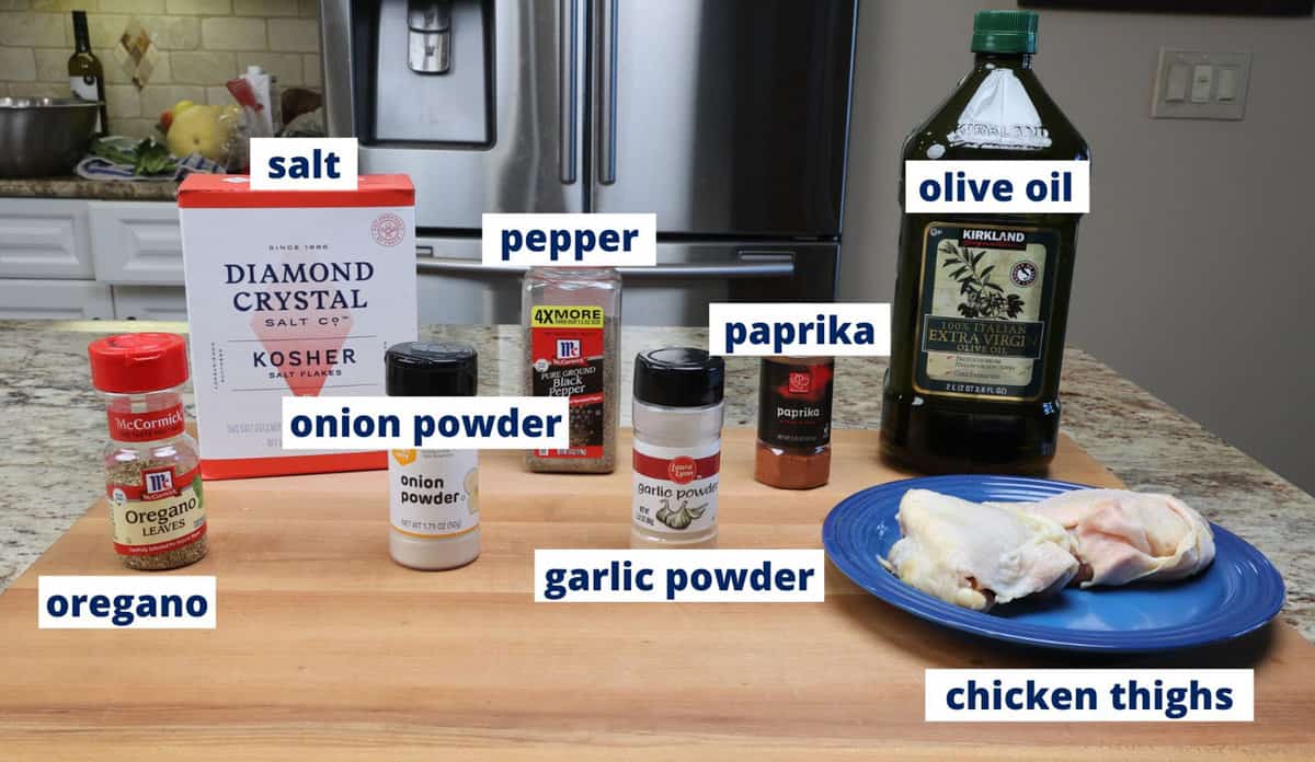 ingredients to make baked chicken thighs on a kitchen counter/
