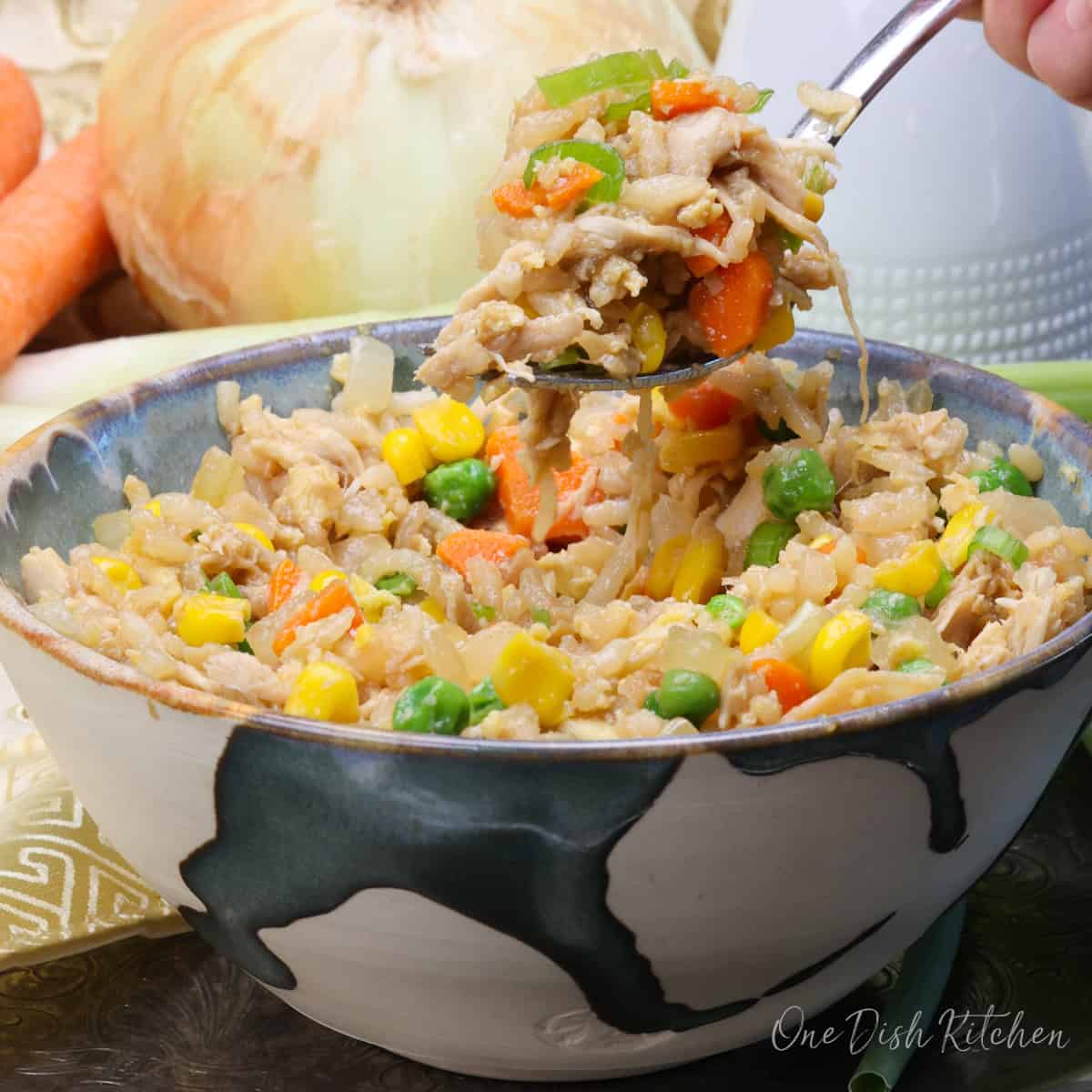 a small batch of chicken fried rice in a bowl.