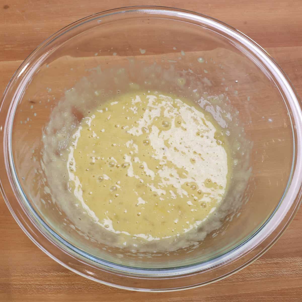 banana bread batter in a mixing bowl.