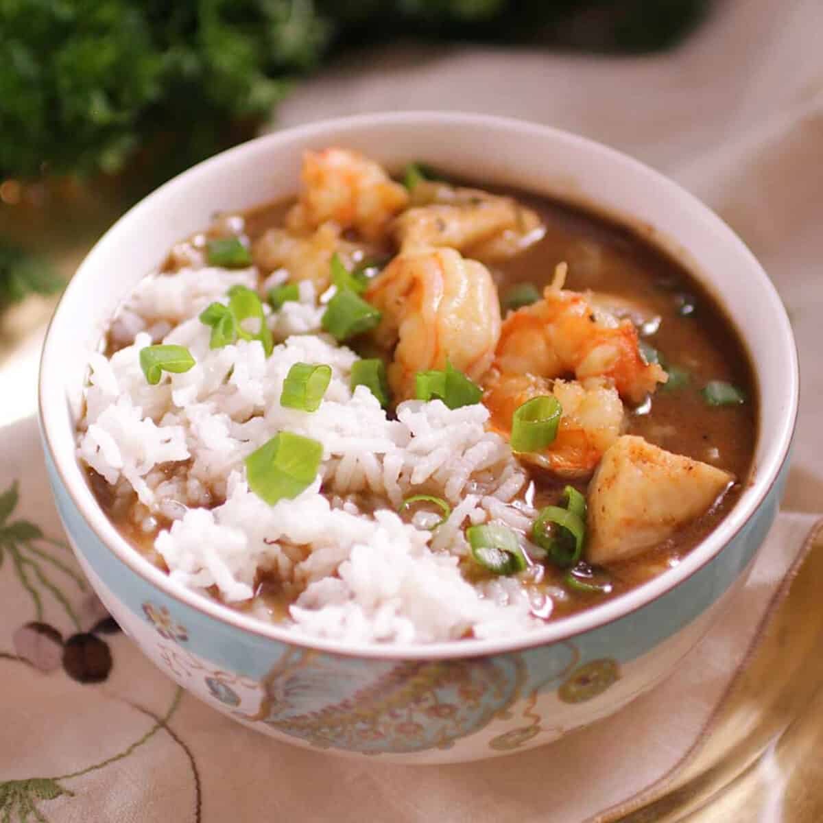 a small bowl of gumbo and white rice.