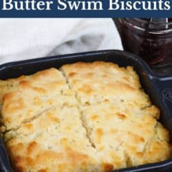 biscuits cut in four in a small dark baking dish.