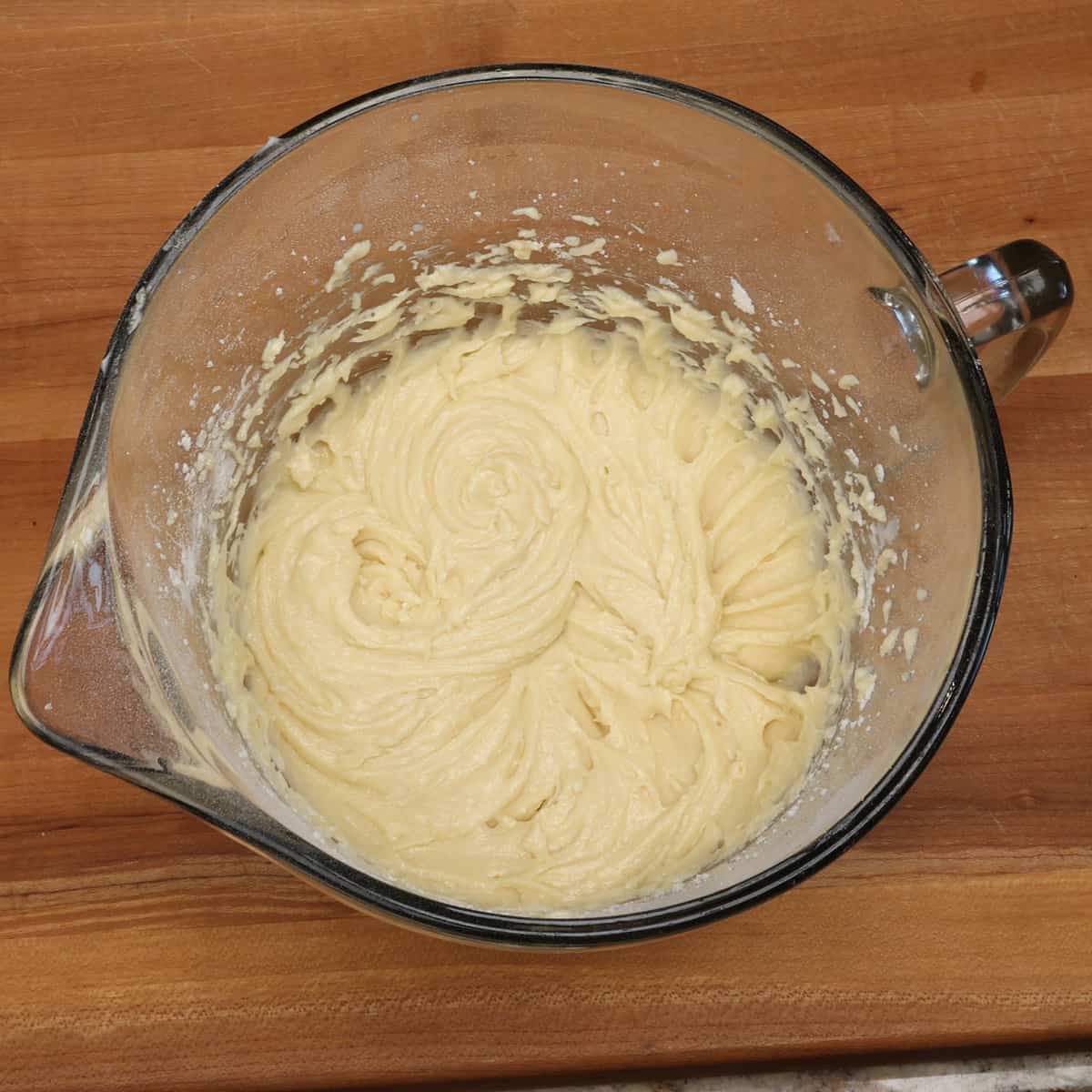 italian cream cake batter in a mixing bowl without nuts and coconut.