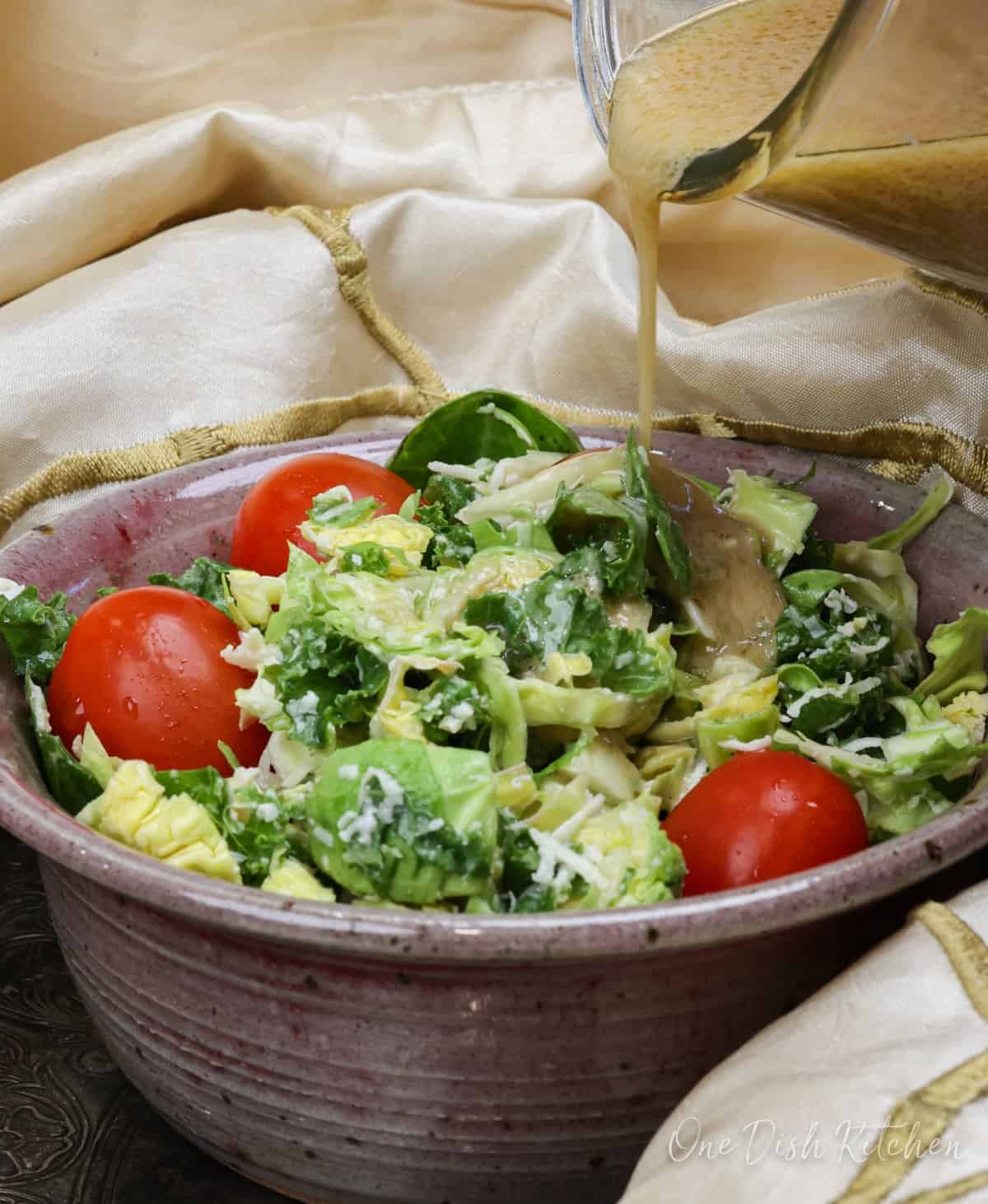 homemade vinaigrette poured over a salad.