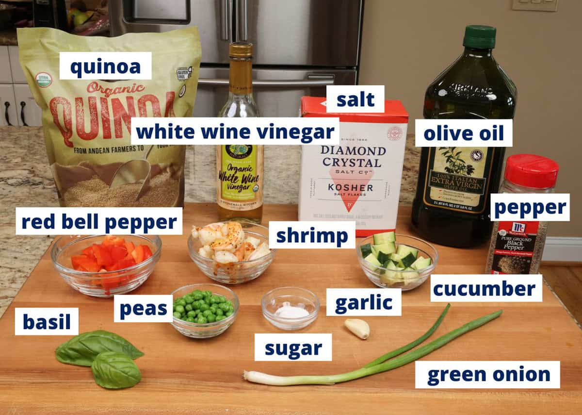 shrimp quinoa bowl ingredients on a kitchen counter.
