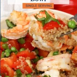 shrimp and red bell peppers on a fork over a bowl of quinoa.