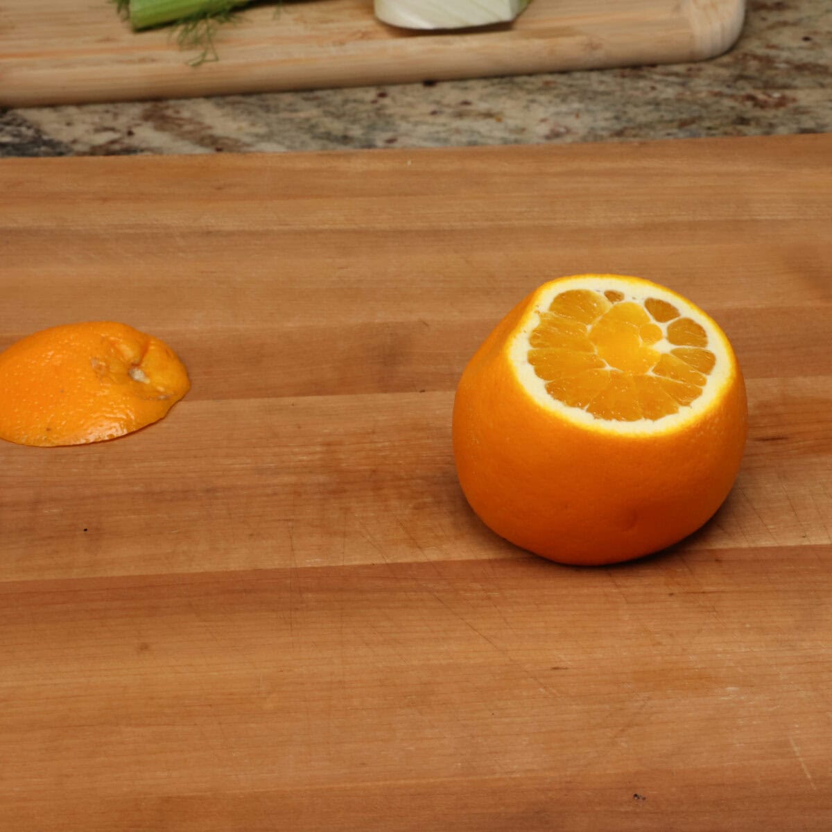 an orange on a table.