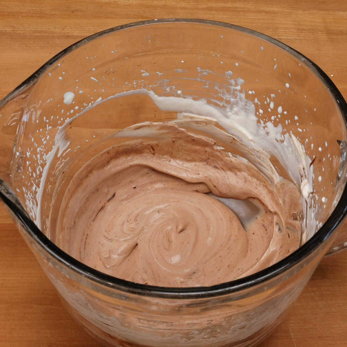 chocolate ice cream mixture in a mixing bowl.