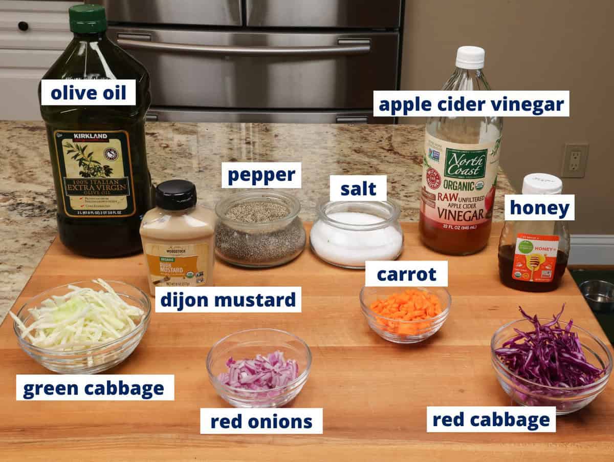 vinegar coleslaw ingredients on a kitchen counter.