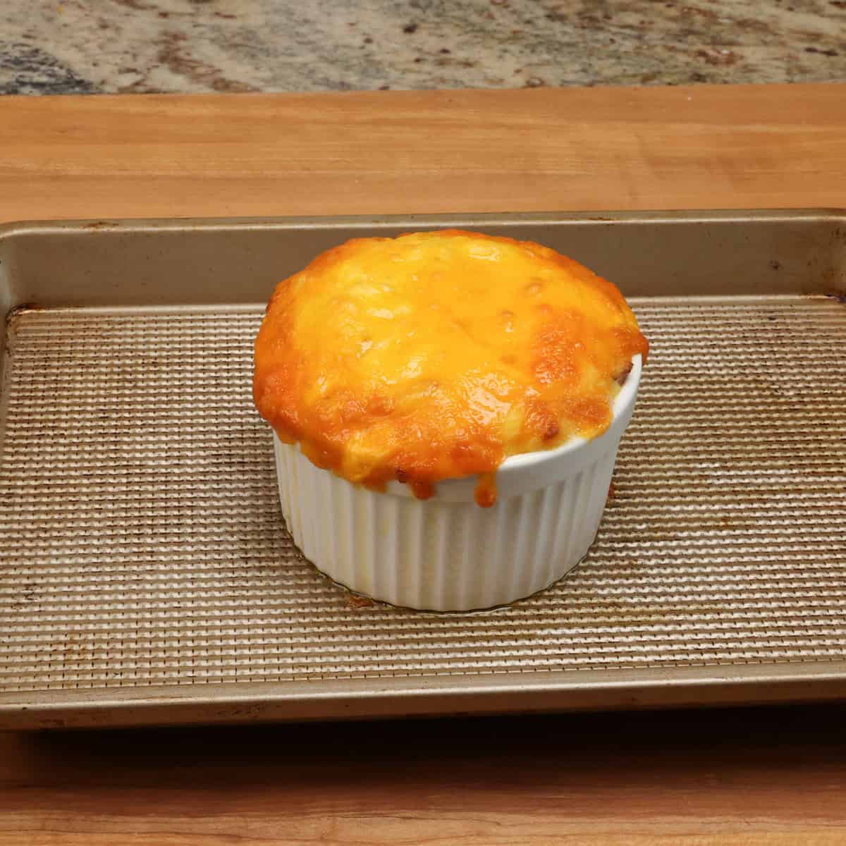 a small baked potato casserole on a rimmed baking sheet.