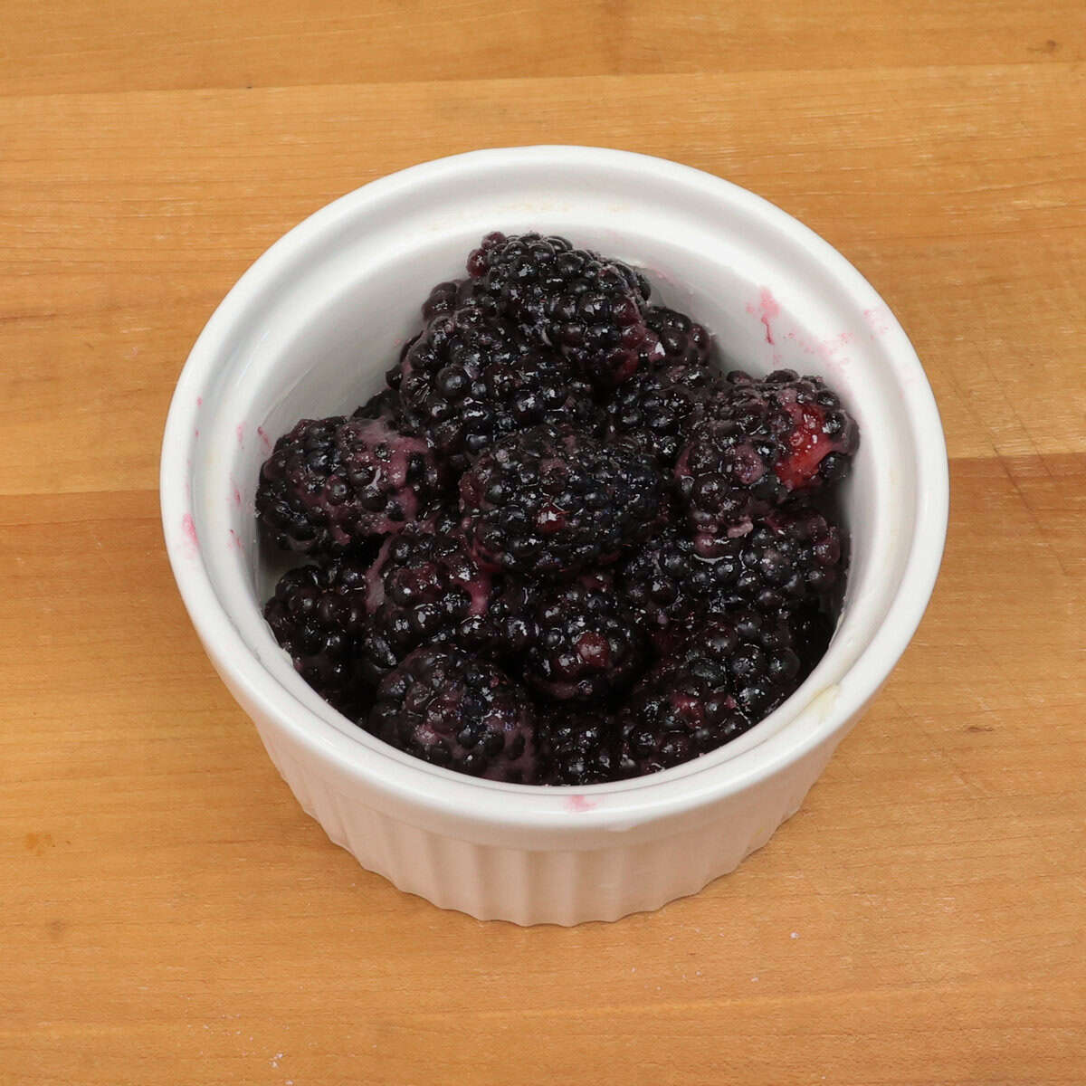 blackberries in a white bowl.