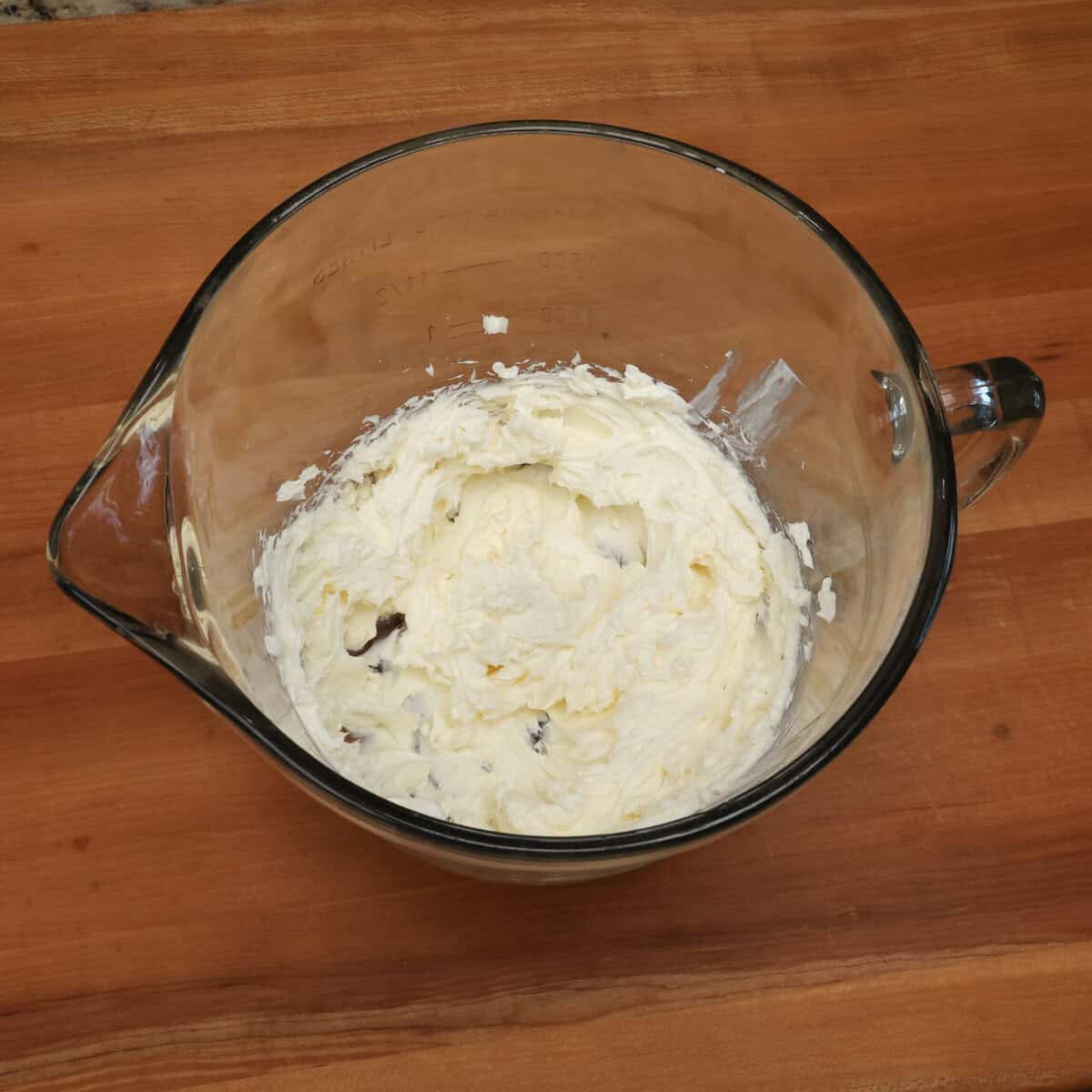 softened cream cheese in a mixing bowl.