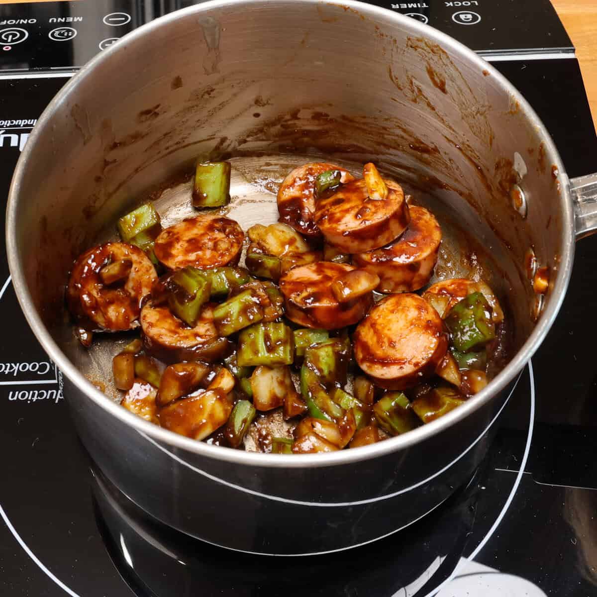 vegetables and sausage cooking in roux.