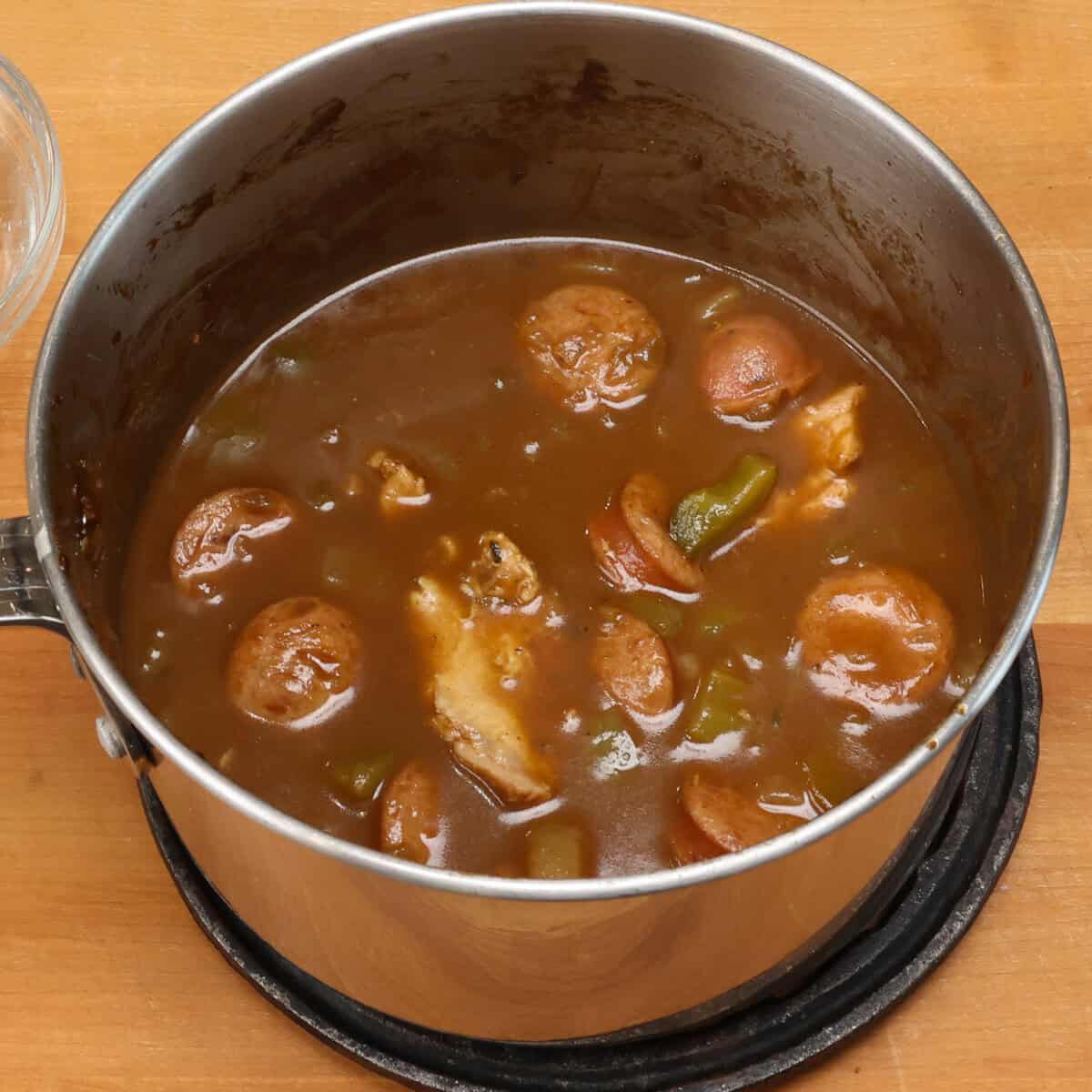 chicken and sausage gumbo simmering on the stove.