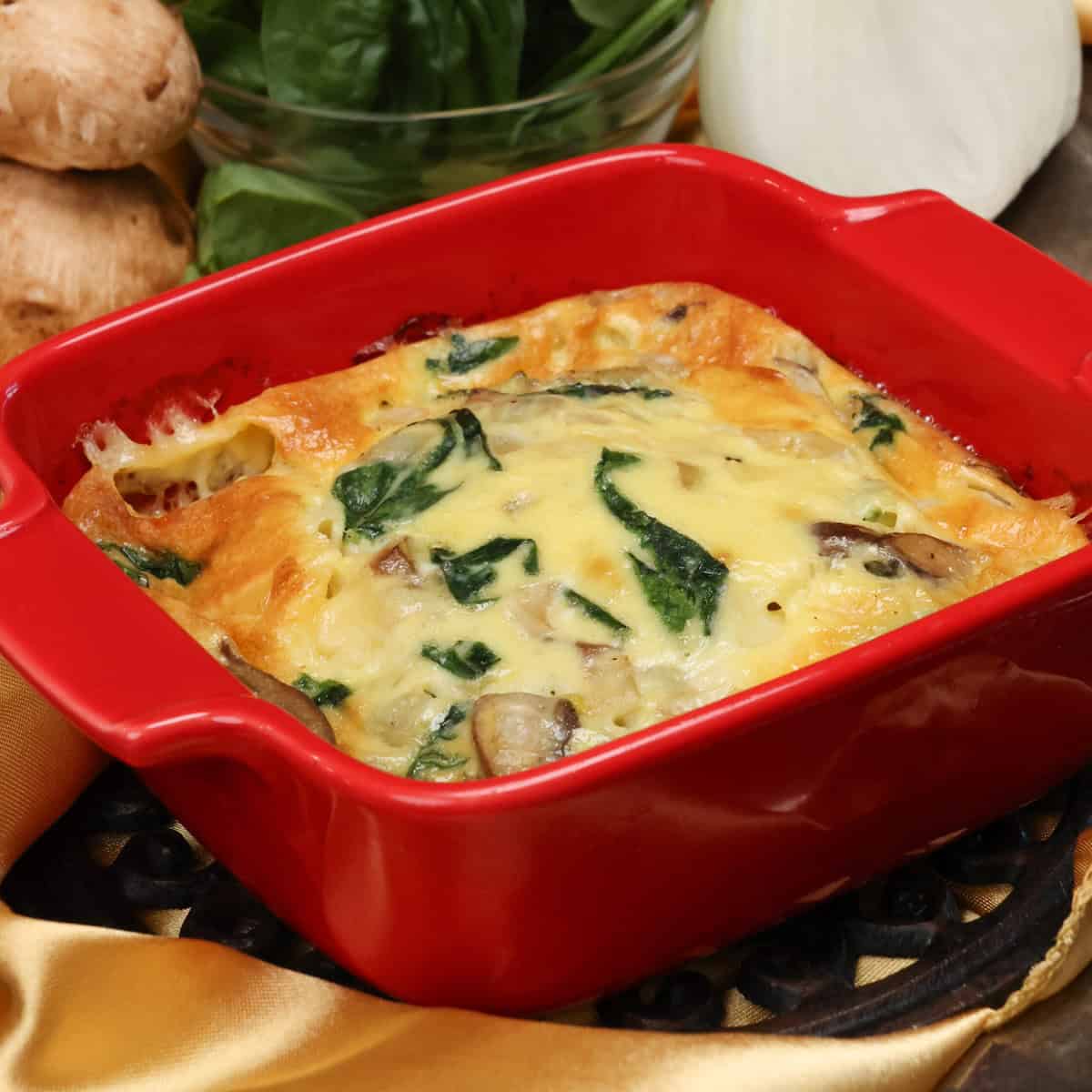 a mini crustless quiche with spinach and mushrooms.