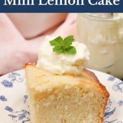 a slice of lemon cake topped with whipped cream next to a pink napkin.