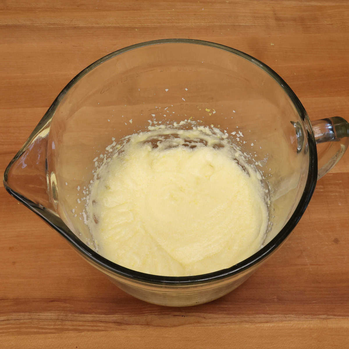 butter, sugar, an egg, lemon juice and zest in a mixing bowl.