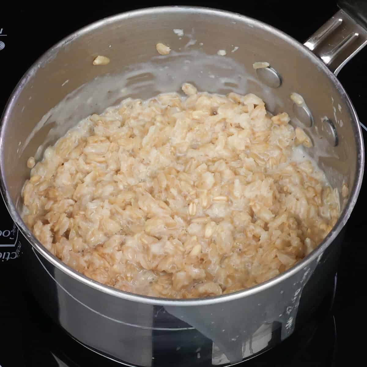 cooked oatmeal in a small pot.