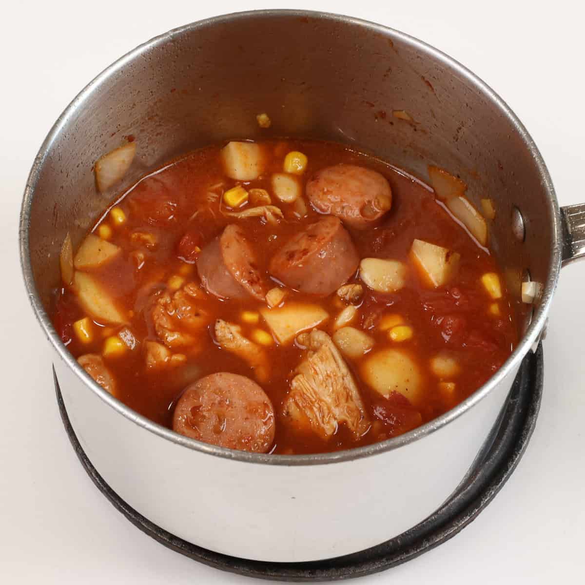 brunswick stew simmering in a pot.