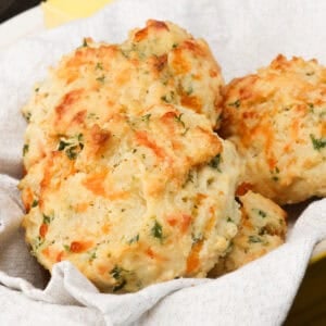 a basket of cheddar biscuits.