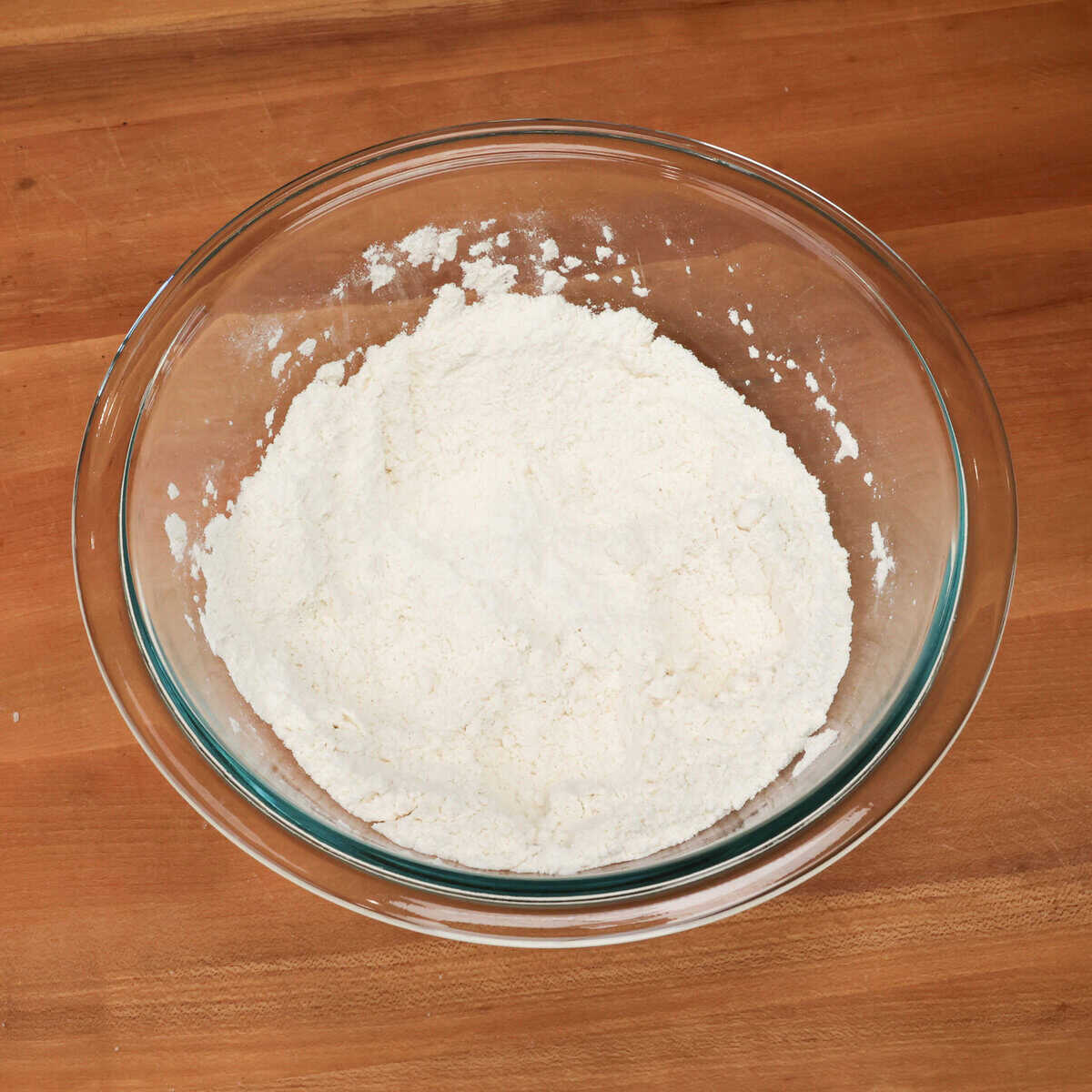 flour, baking powder, sugar, salt, and garlic powder in a mixing bowl.