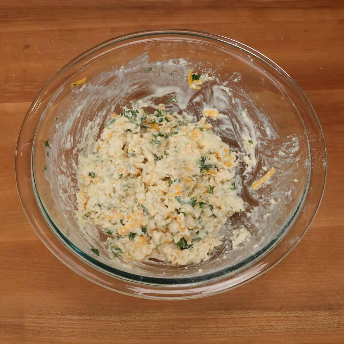 cheddar biscuit dough in a mixing bowl.