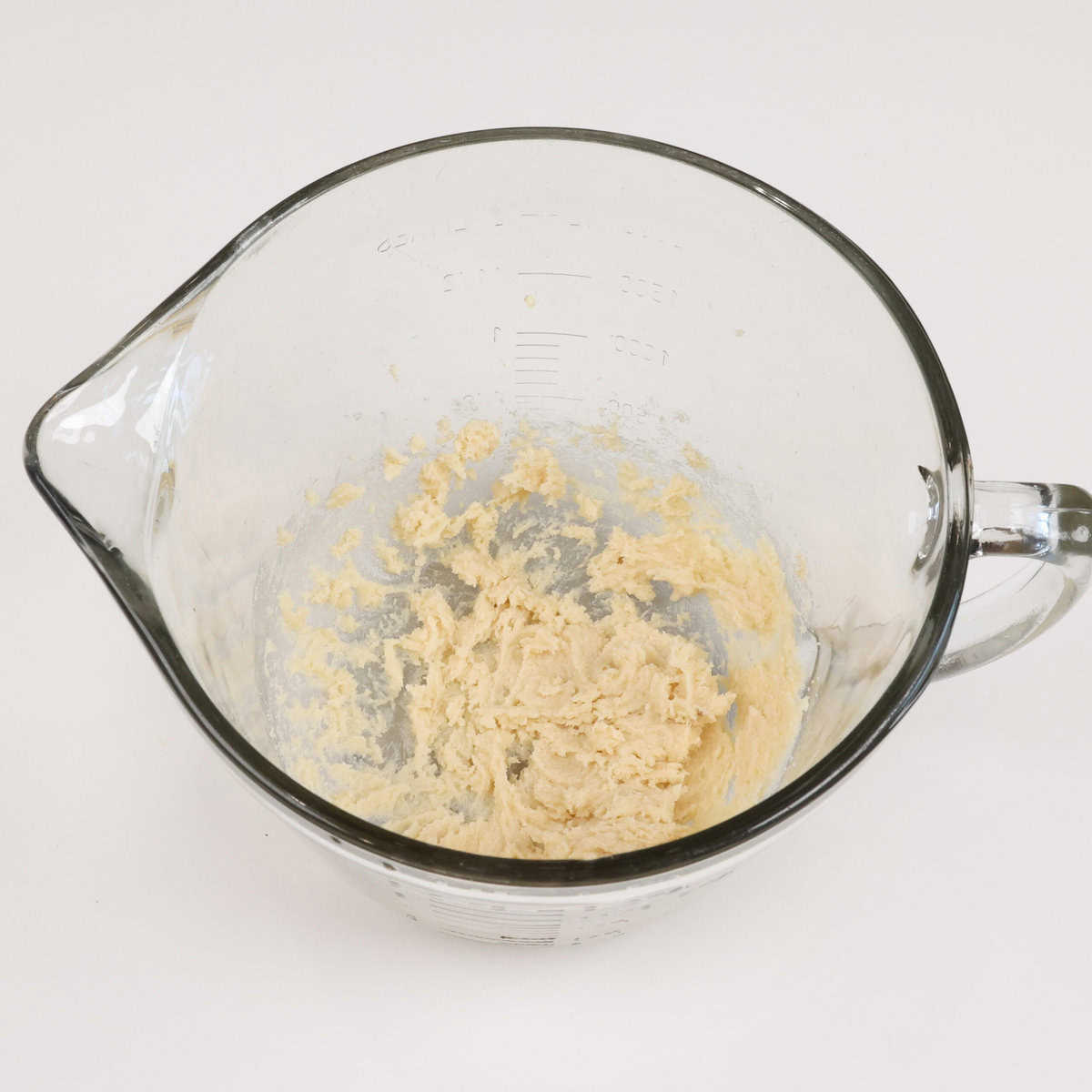 sugar and softened butter in a mixing bowl.